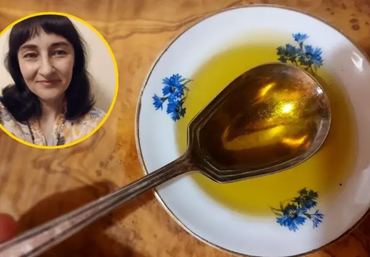 Kobieta w okręgu i łyżka z olejem na talerzyku z chabrami.